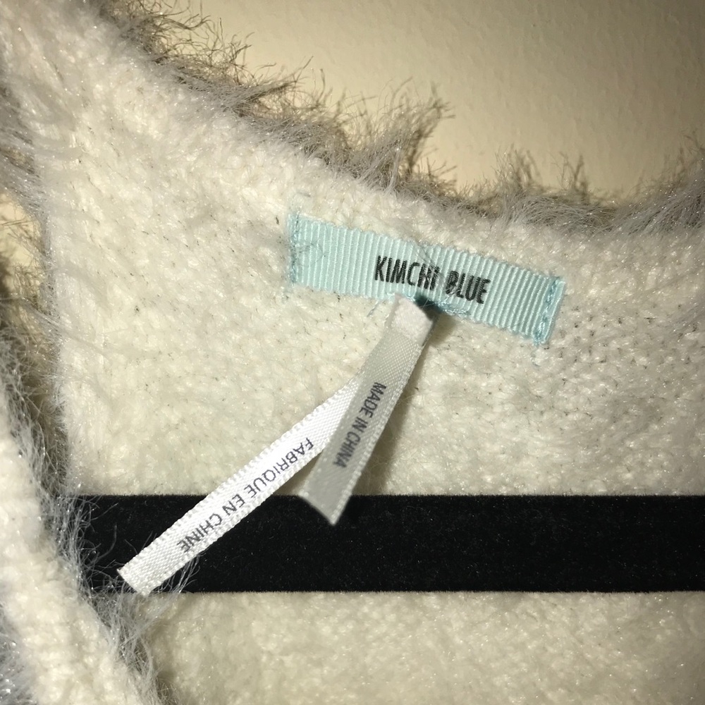 A white fluffy and soft  crop top